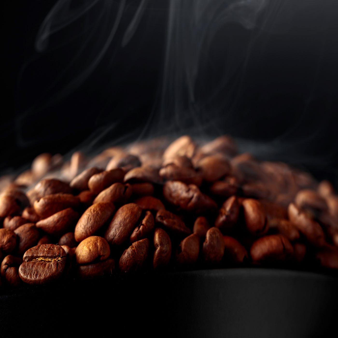 Roasted coffee beans featured in Dame Jo! formulations for antioxidant-rich skincare.